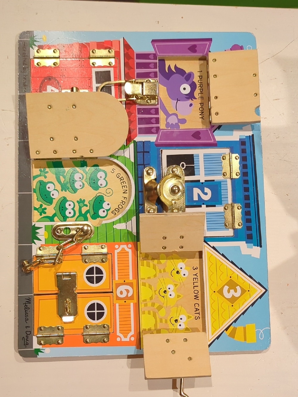 Melissa & Doug Wooden Busy Board with Colorful House Panels and Metal Locks - Picture 4 of 4